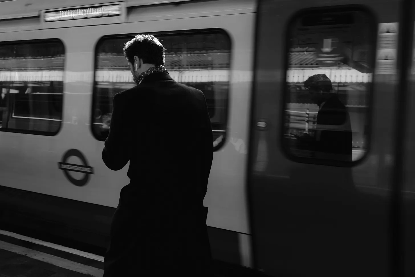 BetterYou cover: a black-and-white commuter beside a passing train.
